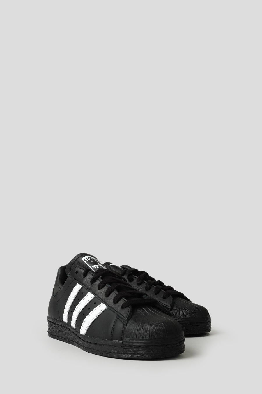ADIDAS - CORE BLACK AND CLOUD WHITE SUPERSTAR 82 SNEAKERS - LE LABO STORE
