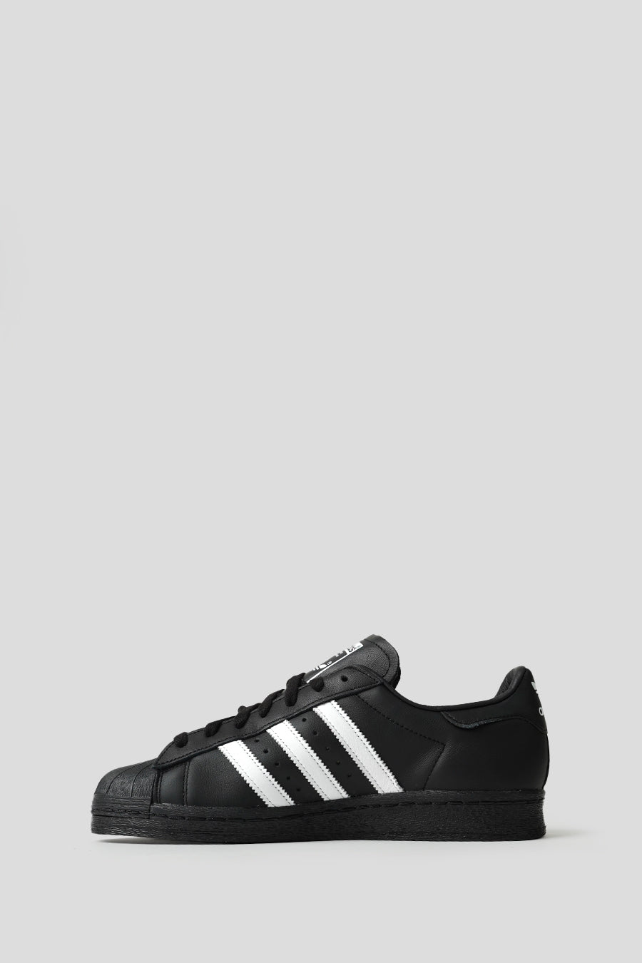 ADIDAS - CORE BLACK AND CLOUD WHITE SUPERSTAR 82 SNEAKERS - LE LABO STORE