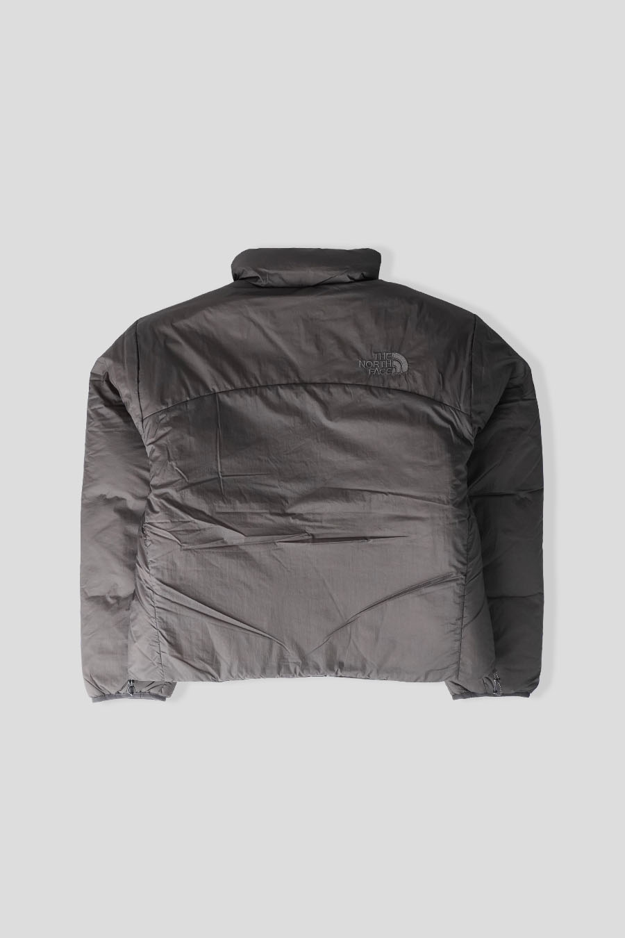 The North Face - DOUDOUNE PERTEX NUPTSE REVERSIBLE NOIR CHARBON - LE LABO STORE
